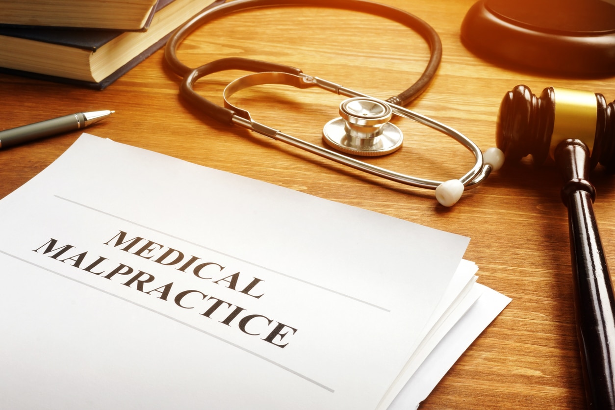 Medical malpractice lawsuit - legal documentation with stethoscope. SHK Law