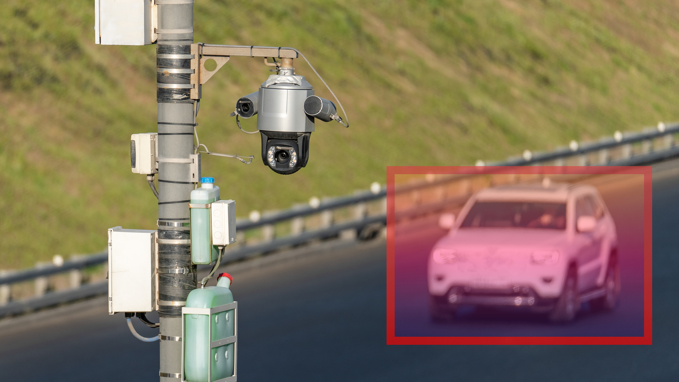 Traffic surveillance system with CCTV cameras monitoring vehicles for speeding.