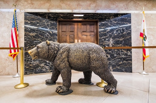 Bronze California grizzly bear statue, symbolizing strength and the pursuit of justice in negligence cases.