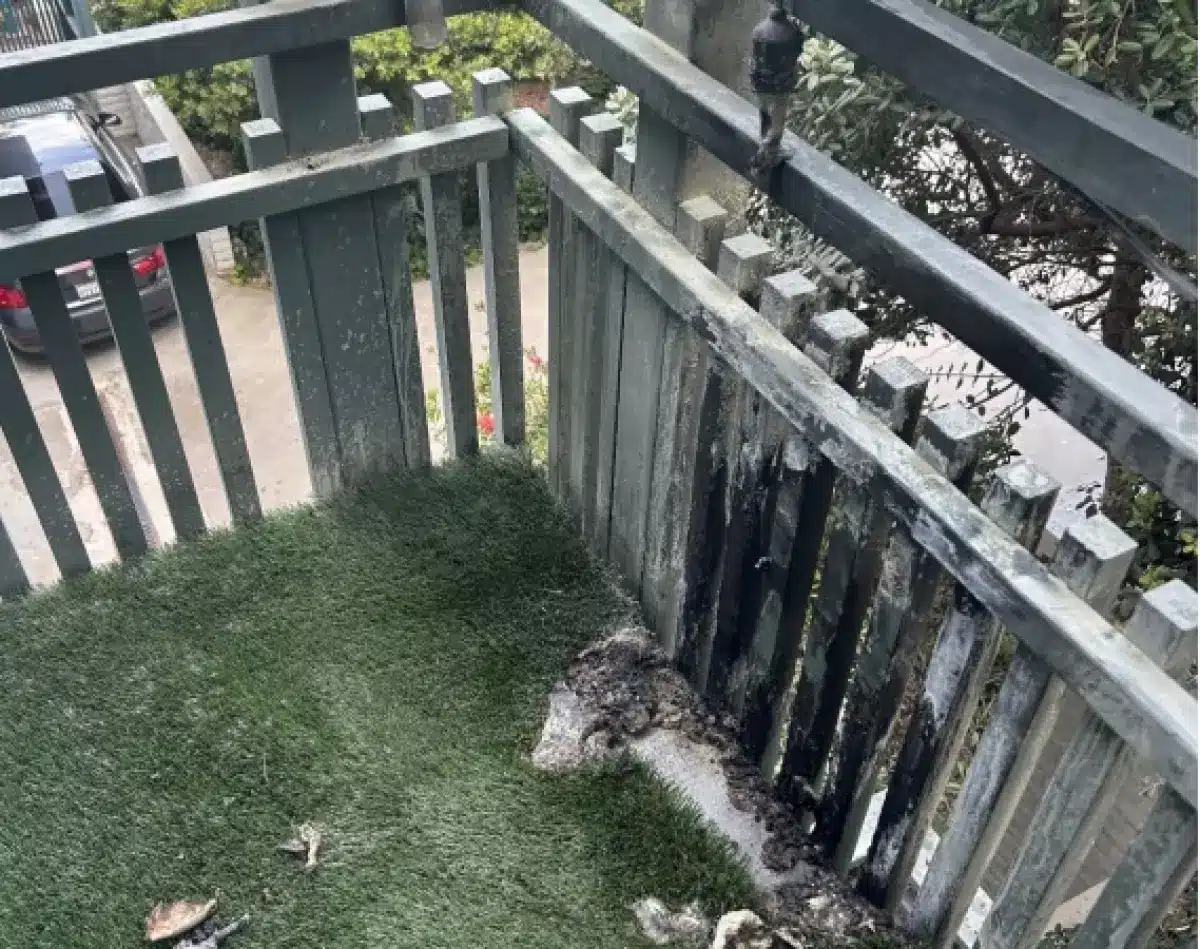 The blast from the tabletop fire pit charred the balcony fencing and melted lights and turf, according to a lawsuit filed by a Navy veteran. (SHK Law Corp.)